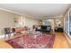 Spacious living room featuring hardwood floors and large windows at 2801 Chelsea Cir, Durham, NC 27707