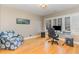 Home office with hardwood floors, a large window, and built-in desk at 2801 Chelsea Cir, Durham, NC 27707