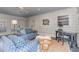 Relaxing sunroom with blue sofas, a writing desk, and marble flooring at 2801 Chelsea Cir, Durham, NC 27707