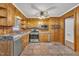 Bright kitchen featuring stainless steel appliances and wood cabinets at 305 S Church St, Pine Level, NC 27568