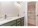 Bathroom featuring a double sink vanity with updated faucets, a tub, and natural lighting at 3212 Potthast Ct, Raleigh, NC 27616