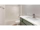 Bathroom featuring a single sink vanity with updated faucet, a tub, and natural lighting at 3212 Potthast Ct, Raleigh, NC 27616
