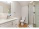Updated bathroom showcases a modern vanity, toilet, and walk-in shower at 3212 Potthast Ct, Raleigh, NC 27616