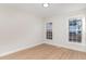 Bedroom featuring wood floors and two large windows that bring in natural light at 3212 Potthast Ct, Raleigh, NC 27616