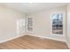Bright bedroom featuring wood floors and two large windows at 3212 Potthast Ct, Raleigh, NC 27616