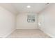 Bright bedroom features neutral paint and plush carpeting, enhanced by natural light at 3212 Potthast Ct, Raleigh, NC 27616