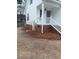 Exterior of a well-maintained home with a charming side entrance and manicured landscaping at 3212 Potthast Ct, Raleigh, NC 27616