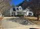 Charming home showcasing a well-maintained lawn, traditional architectural elements, and a welcoming front porch at 3212 Potthast Ct, Raleigh, NC 27616