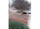 Spacious front yard with mature trees, landscape beds, and a neatly kept lawn at 3212 Potthast Ct, Raleigh, NC 27616