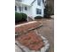 Charming home with a well-maintained front yard, complemented by lush landscaping and inviting walkway at 3212 Potthast Ct, Raleigh, NC 27616