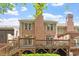 Brick home's backyard featuring multi-level deck and meticulous landscaping at 3347 Ridgecrest Ct, Raleigh, NC 27607