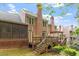 Multi-level backyard decks on a brick home with mature landscaping and shade at 3347 Ridgecrest Ct, Raleigh, NC 27607