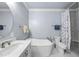 Serene bathroom featuring a soaking tub, separate shower, and modern fixtures for a spa-like experience at 3347 Ridgecrest Ct, Raleigh, NC 27607