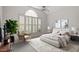This is a bright bedroom with a large window, high ceilings, and stylish decor, creating a relaxing atmosphere at 3347 Ridgecrest Ct, Raleigh, NC 27607