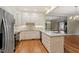 Open kitchen featuring stainless appliances, center island, and view into living area at 3347 Ridgecrest Ct, Raleigh, NC 27607