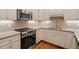 Modern kitchen boasting stainless steel appliances, light countertops, and ample cabinet space at 3347 Ridgecrest Ct, Raleigh, NC 27607