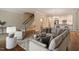 Comfortable living room with neutral tones, staircase, and open flow to the kitchen at 3347 Ridgecrest Ct, Raleigh, NC 27607