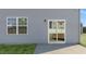 Home's back exterior with sliding glass door at 435 Blue Aspen Dr, Fuquay Varina, NC 27526