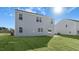 Spacious backyard with grassy lawn and patio at 435 Blue Aspen Dr, Fuquay Varina, NC 27526