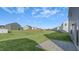 Large backyard with grassy area and homes at 435 Blue Aspen Dr, Fuquay Varina, NC 27526