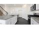 Modern kitchen with white cabinets, granite countertops, and island at 435 Blue Aspen Dr, Fuquay Varina, NC 27526