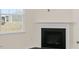 Living room showcasing a cozy gas fireplace at 435 Blue Aspen Dr, Fuquay Varina, NC 27526