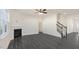 Living room featuring a corner fireplace and dark laminate flooring at 435 Blue Aspen Dr, Fuquay Varina, NC 27526