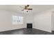Living room with a corner fireplace and ceiling fan at 435 Blue Aspen Dr, Fuquay Varina, NC 27526