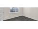 Home office with gray vinyl plank flooring and a large window at 435 Blue Aspen Dr, Fuquay Varina, NC 27526