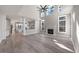 Spacious living room with fireplace, high ceilings, and luxury vinyl plank flooring at 4703 Paces Ferry Dr, Durham, NC 27712