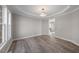 Open-concept living room with recessed lighting and hardwood flooring throughout at 4703 Paces Ferry Dr, Durham, NC 27712