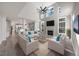 Bright living room features a fireplace, large windows, and soaring ceilings at 4703 Paces Ferry Dr, Durham, NC 27712