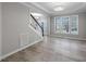 Spacious, naturally lit living room, with hardwood floors and modern finishes at 4703 Paces Ferry Dr, Durham, NC 27712