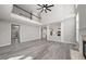 Bright living room features soaring ceilings, a fireplace, and luxury vinyl plank flooring at 4703 Paces Ferry Dr, Durham, NC 27712