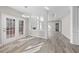 Bright living room with luxury vinyl plank flooring and elegant white columns at 4703 Paces Ferry Dr, Durham, NC 27712