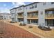 Townhome exterior with a private patio and deck. Beautiful, landscaped backyard with private entrances at 4804 Cypress Tree Ln, Raleigh, NC 27612
