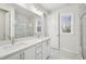 Beautiful bathroom features a double vanity, a large mirror, and a glass-enclosed shower at 4804 Cypress Tree Ln, Raleigh, NC 27612