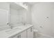 Modern bathroom featuring double sink vanity with a large mirror and updated lighting at 4804 Cypress Tree Ln, Raleigh, NC 27612