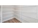 Walk-in pantry provides ample storage space with its extensive wire shelving, a fantastic feature for organization at 4804 Cypress Tree Ln, Raleigh, NC 27612