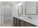 Bathroom with double sinks, granite counters, tile floor and shower/tub combo at 50 Arbor Dr, Youngsville, NC 27596