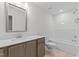 Modern bathroom featuring a single sink, quartz counters, and a shower/tub combo at 50 Arbor Dr, Youngsville, NC 27596