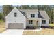 Charming single-Gathering home featuring a two-car garage and a meticulously maintained lawn with mature landscaping at 50 Arbor Dr, Youngsville, NC 27596