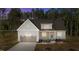 Charming single-Gathering home featuring a two-car garage and a meticulously maintained lawn with mature landscaping at 50 Arbor Dr, Youngsville, NC 27596