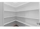 Spacious pantry with ample shelving for organized storage at 50 Arbor Dr, Youngsville, NC 27596