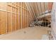 Unfinished attic is framed with wood beams, ready for customization and storage at 50 Arbor Dr, Youngsville, NC 27596