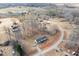 Aerial view showing home's location in a quiet, wooded neighborhood at 5724 Walters Ln, Burlington, NC 27217