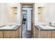 Modern bathroom with double sinks and vanities at 5724 Walters Ln, Burlington, NC 27217