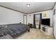 Spacious bedroom with large TV and window at 5724 Walters Ln, Burlington, NC 27217