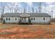 Gray single story home with a covered porch and landscaping at 5724 Walters Ln, Burlington, NC 27217