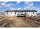 Back exterior view with deck and yard at 5724 Walters Ln, Burlington, NC 27217